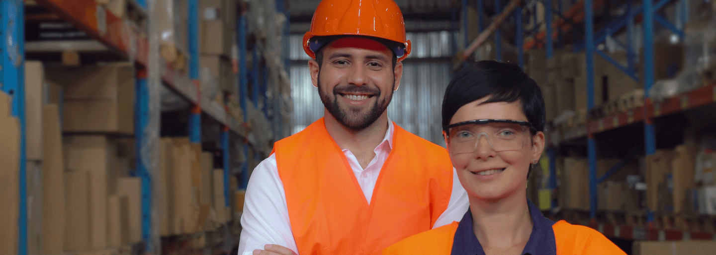 A man and a woman in protective gear