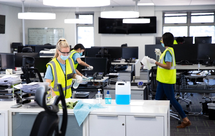 Workers cleaning an office