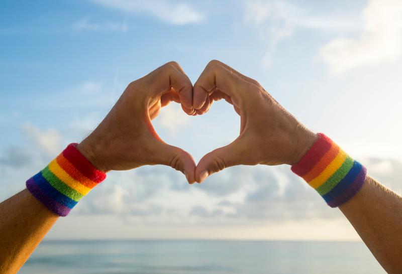 Rainbow hands in a heart shape