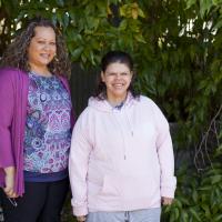 Two women smiling at the camera