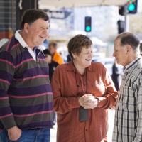 2 men and1 women chatting